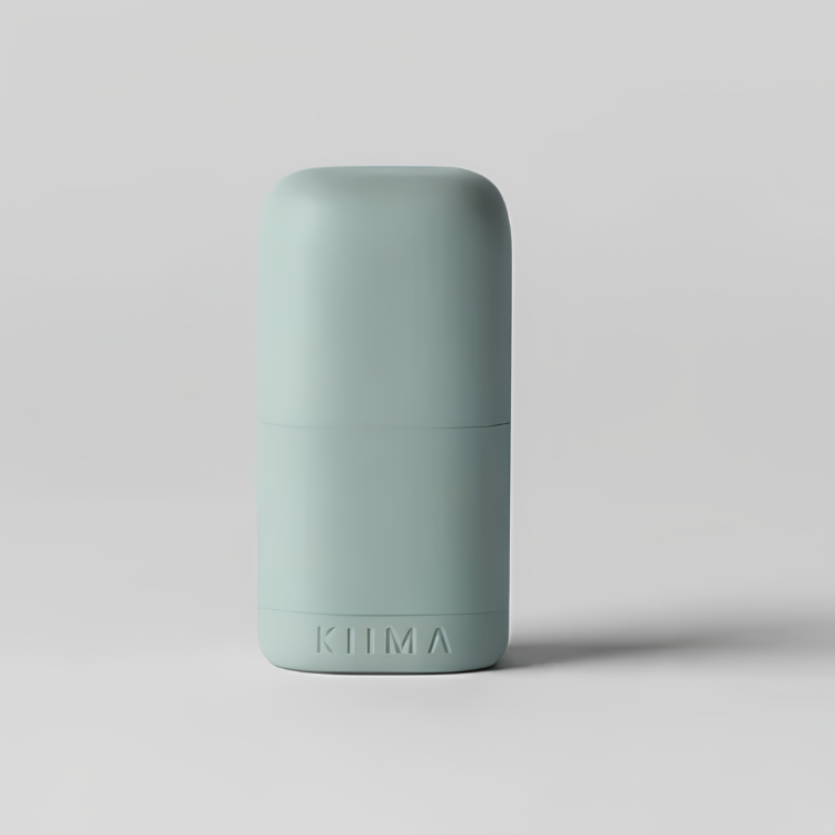 Un applicateur rechargeable de couleur verte avec une écriture Kiima sur un fond gris.