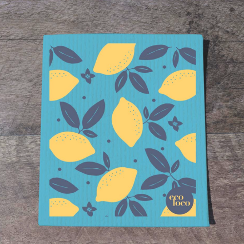 Chiffon suédois avec des citrons jaune sur un fond bleu déposés sur une planche de bois et avec le logo de Eco Loco