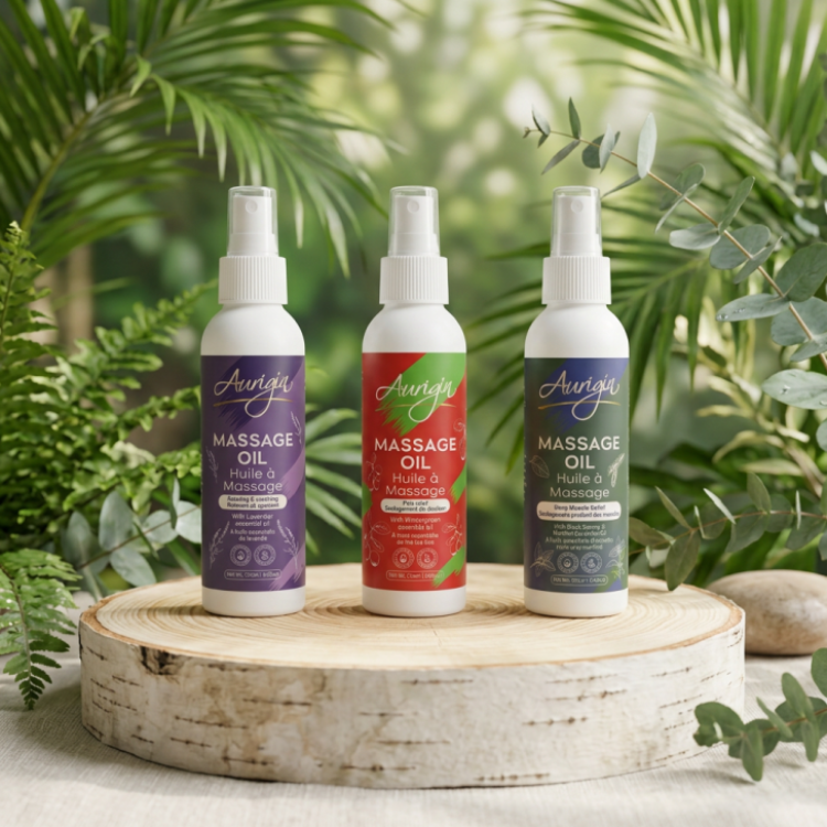 Les 3 pots vaporisateur d'huile à massage naturelle de la compagnie Aurigin sur un rondin en bois et un fond végétal.