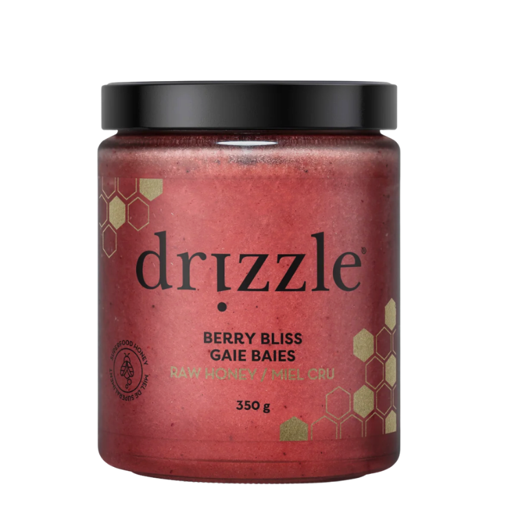 Pot de miel cru aux petits fruits de 350 grammes de la marque drizzle sur un fond blanc.