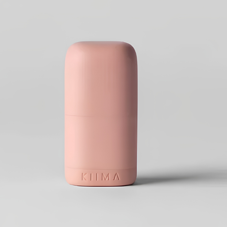 Un applicateur rechargeable de couleur rose avec une écriture Kiima sur un fond gris.