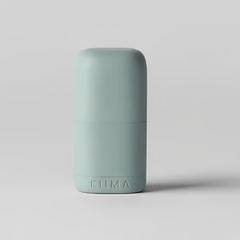 Un applicateur rechargeable de couleur verte avec une écriture Kiima sur un fond gris. 