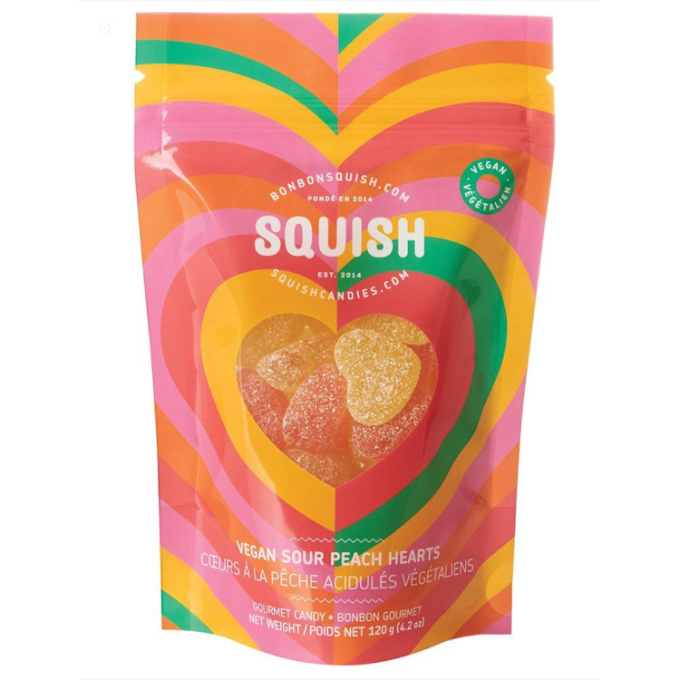 Sac de bonbon vegan à la saveur de pêche acidulée  la marque squish sur un Un fond blanc. Vendu par Eco Loco,  Le sac est orangé