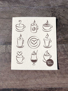 Chiffon suédois beige blanc sur un fond de bois foncé avec le logo Eco Loco au motif de café