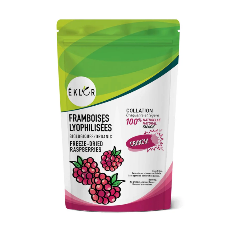 Un sac vert, blanc et rouge avec des framboises locales biologiques lyophilisés, une collation craquante, légère et 100% naturelle. 